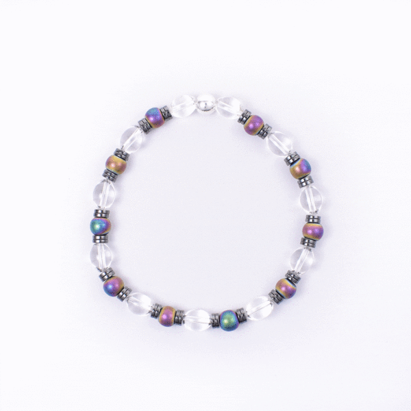 Handmade bracelet made of natural, spherical shaped crystal quartz and oxidized hematite gemstones, which are alternated and separated by hematite gemstone grommets. The stones are set in a durable silicone rubber.