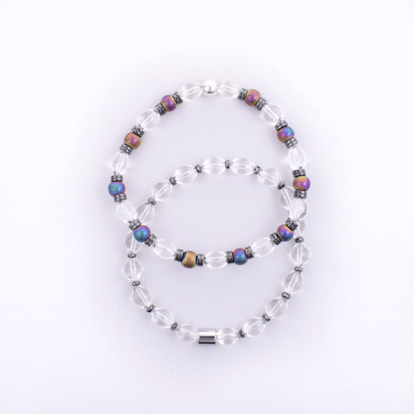 Handmade bracelet made of natural, spherical shaped crystal quartz and oxidized hematite gemstones, which are alternated and separated by hematite gemstone grommets. The stones are set in a durable silicone rubber.