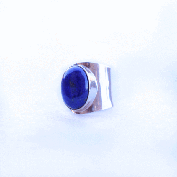 Handmade sterling silver ring with natural, oval shaped lapis lazuli gemstone. The size of the ring is adjustable. 