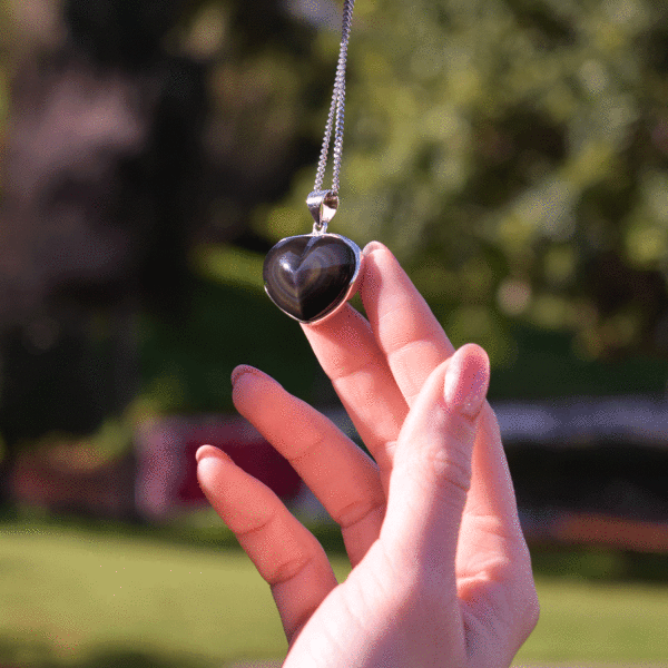 Handmade sterling silver necklace of natural, heart-shaped rainbow obsidian gemstone. 