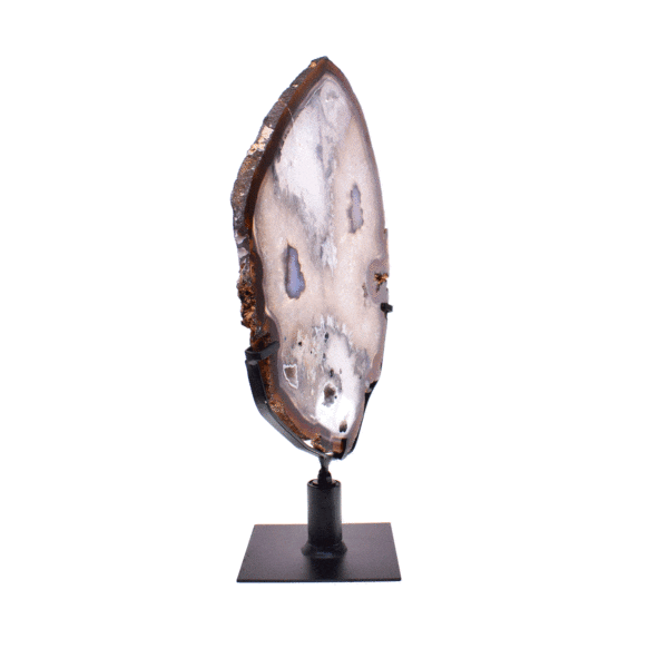 Thin, polished slice of natural agate gemstone with crystal quartz formations from Brazil, in warm earthy tones. Mounted on a black rotating metal base, this elegant piece stands 37cm tall.