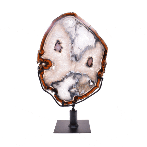Thin, polished slice of natural agate gemstone with crystal quartz formations from Brazil, in warm earthy tones. Mounted on a black rotating metal base, this elegant piece stands 37cm tall.