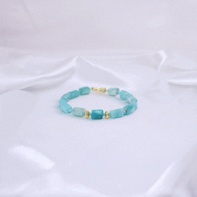 Handmade bracelet made of natural, raw amazonite stones in cylindrical shape, decorated with natural pyrite, amazonite and gold-plated sterling silver details.