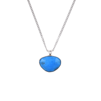 Handmade sterling silver pendant featuring a natural, irregular-shaped Turquoise stone, threaded on a fine silver chain.