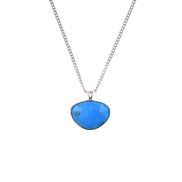 Handmade sterling silver pendant featuring a natural, irregular-shaped Turquoise stone, threaded on a fine silver chain.