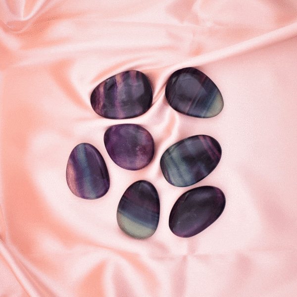 Natural, polished Fluorite palm stones, displaying vivid purple and green zoning. The size ranges from 4.0cm to 4.5cm, ideal for meditation, energy protection or as a decorative and collectible piece.