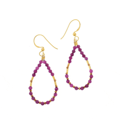 Handmade earrings made of natural, spherical, faceted ruby stones and small gold-plated hematite grommets. The necklace features gold-plated sterling silver elements and clasp, adding luxury and sparkle, creating a piece of jewellery that exudes femininity and power.