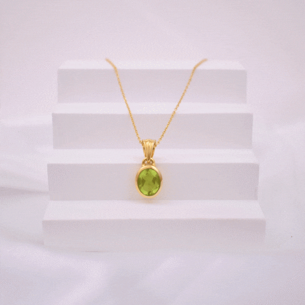 Handmade necklace made of natural Peridot stone in an oval shape and gold-plated sterling silver. The length of the chain is adjustable and it ranges from 40cm (minimum) until 45cm (maximum).