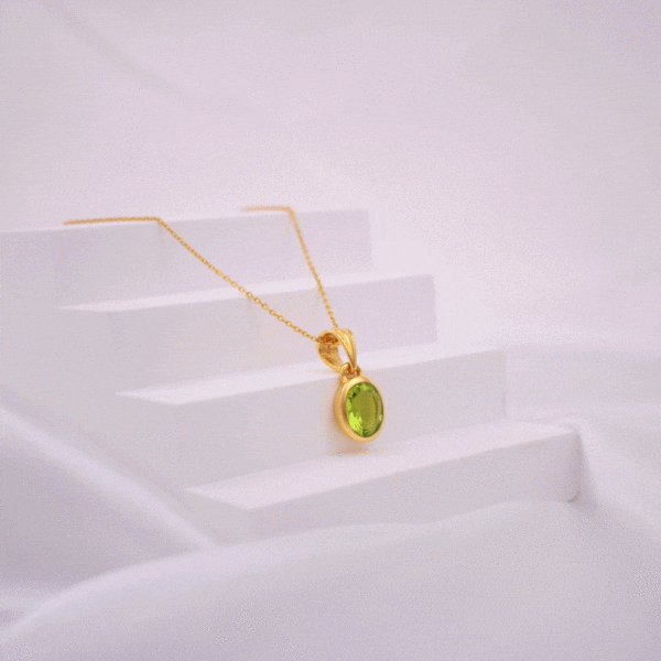 Handmade necklace made of natural Peridot stone in an oval shape and gold-plated sterling silver. The length of the chain is adjustable and it ranges from 40cm (minimum) until 45cm (maximum).