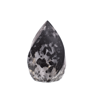 Natural black tourmaline in crystal quartz, polished and curved into a flame shape. It has a cut, flat base and is approximately 11cm high.